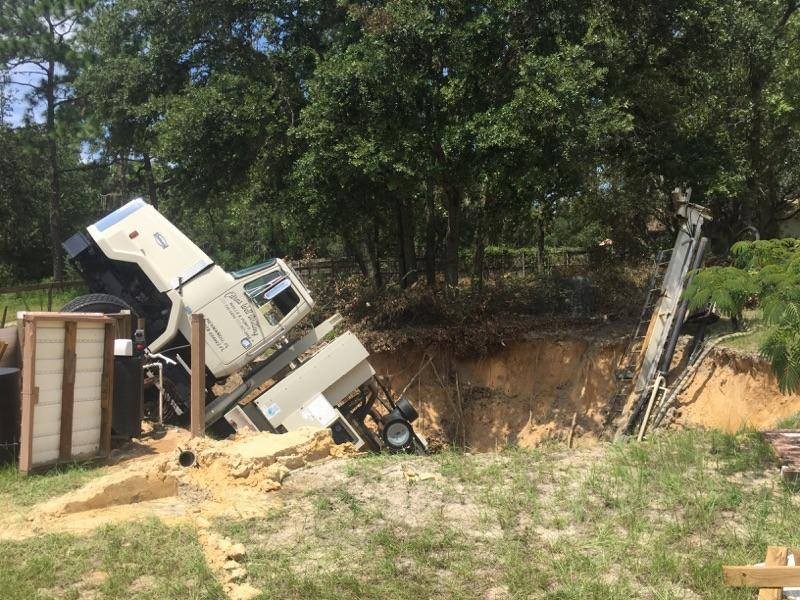 Photos Possible Sinkhole Swallows Truck in Florida New Port Richey