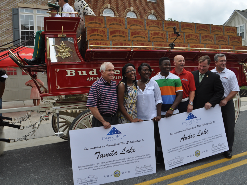 Folds of Honor, Budweiser Clydesdales Deliver Scholarships to Laurel Military Family Laurel