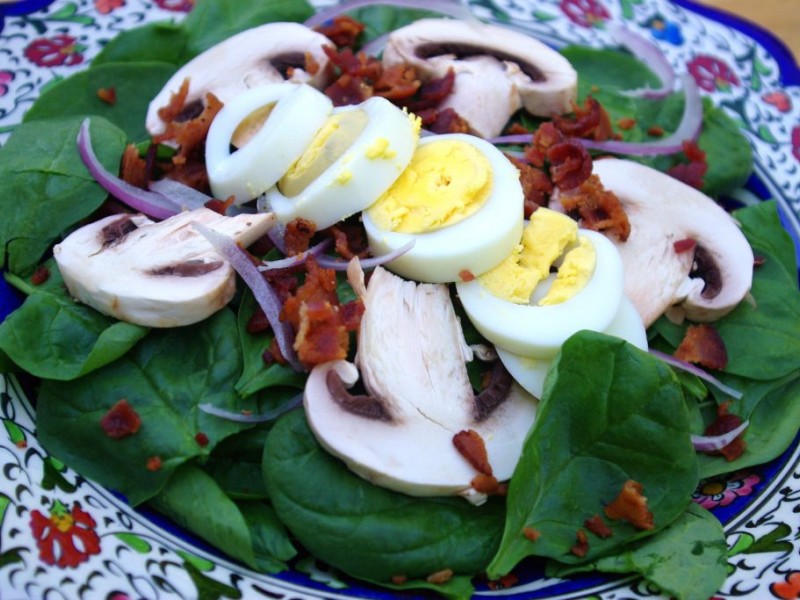 Spinach Salad With Crumbled Bacon And Hard Boiled Egg Drizzled With A Warm Bacon Vinaigrette 8034