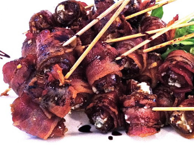 Bacon wrapped dates stuffed with Maytag Bleu cheese and finished with a